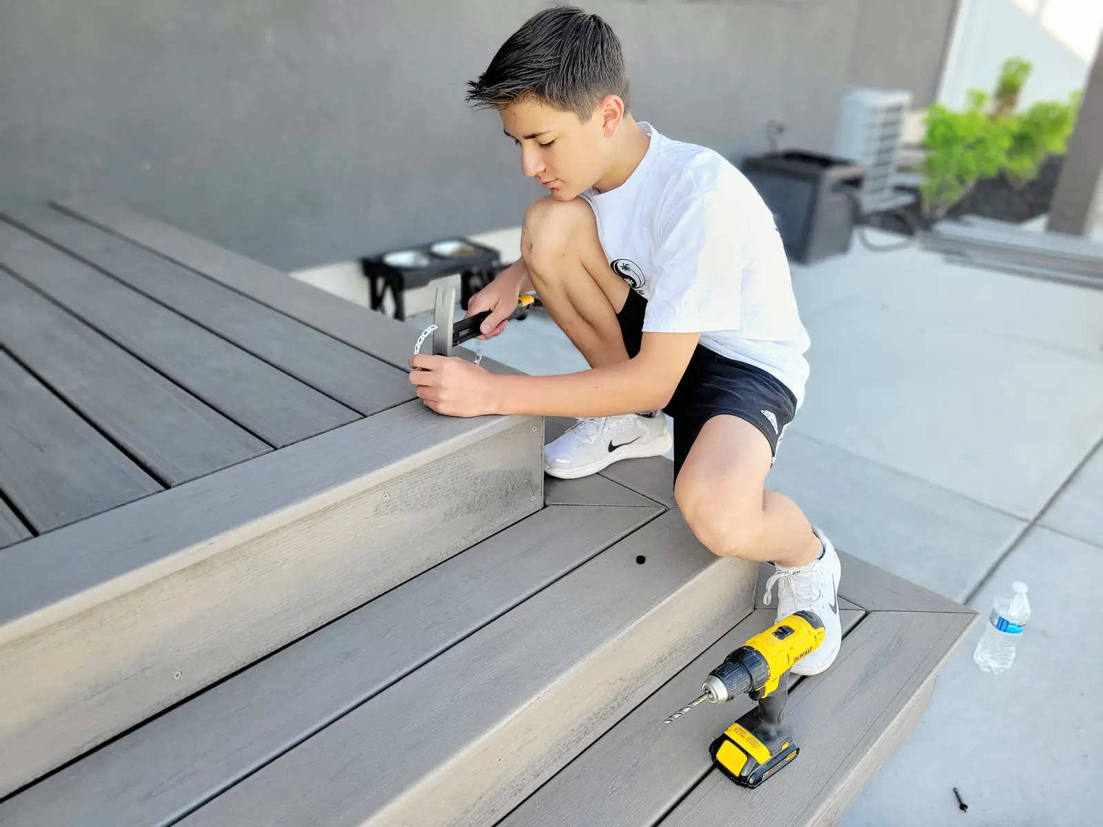 Phinn Tippetts setting Cortex plugs on composite deck stairs