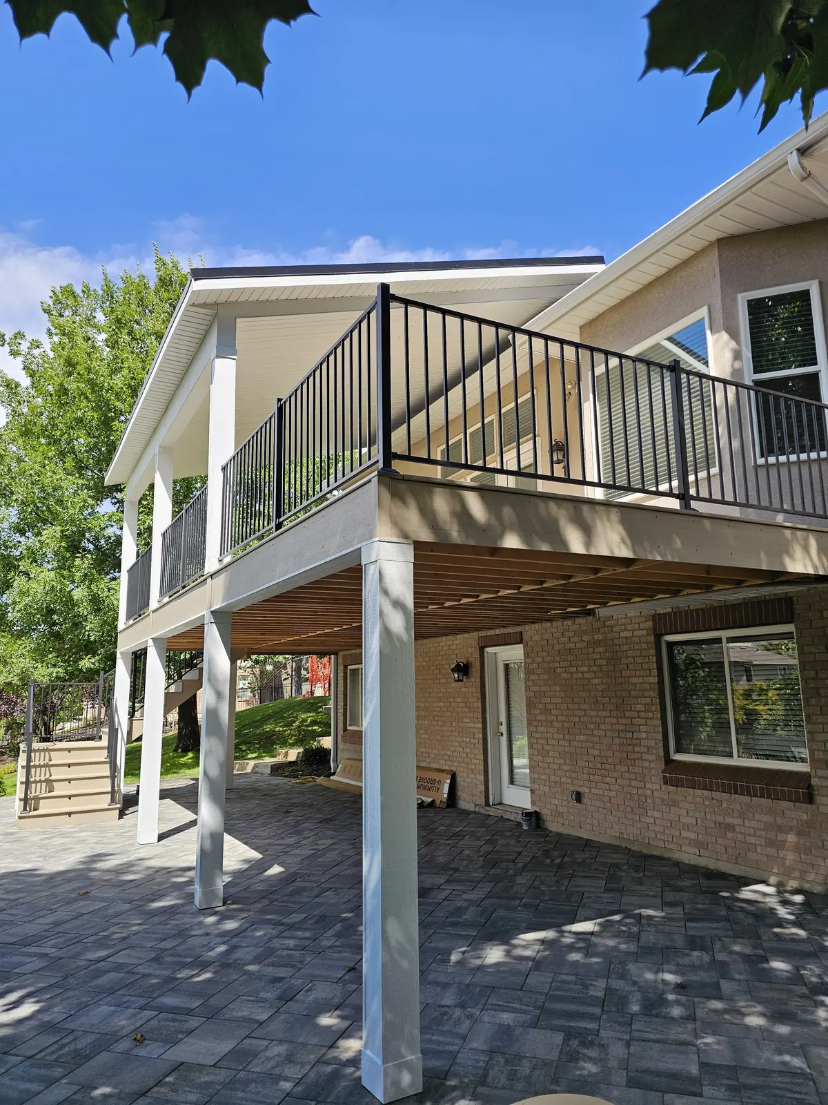 Covered deck with a paver patio underneath