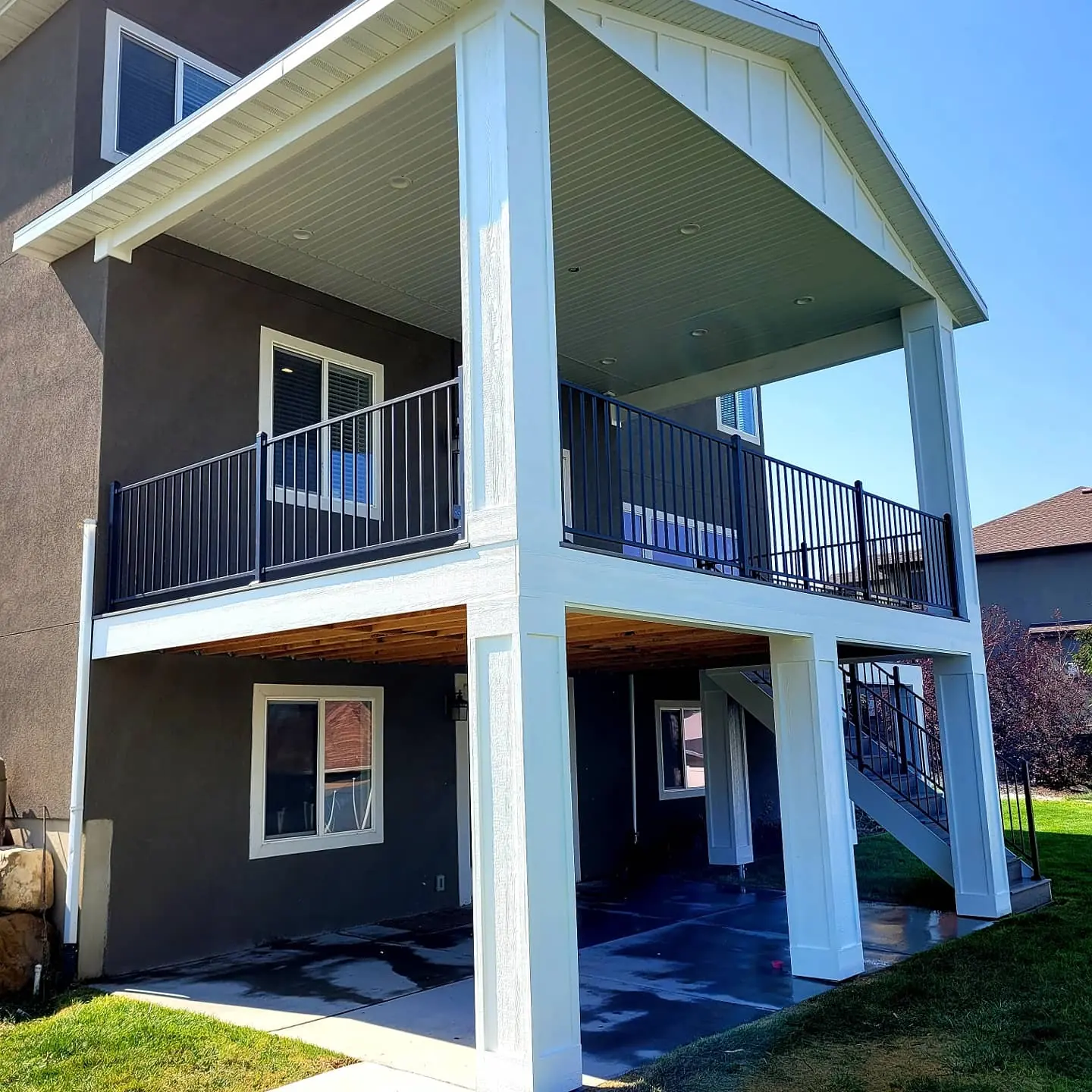Covered two-story deck with white columns