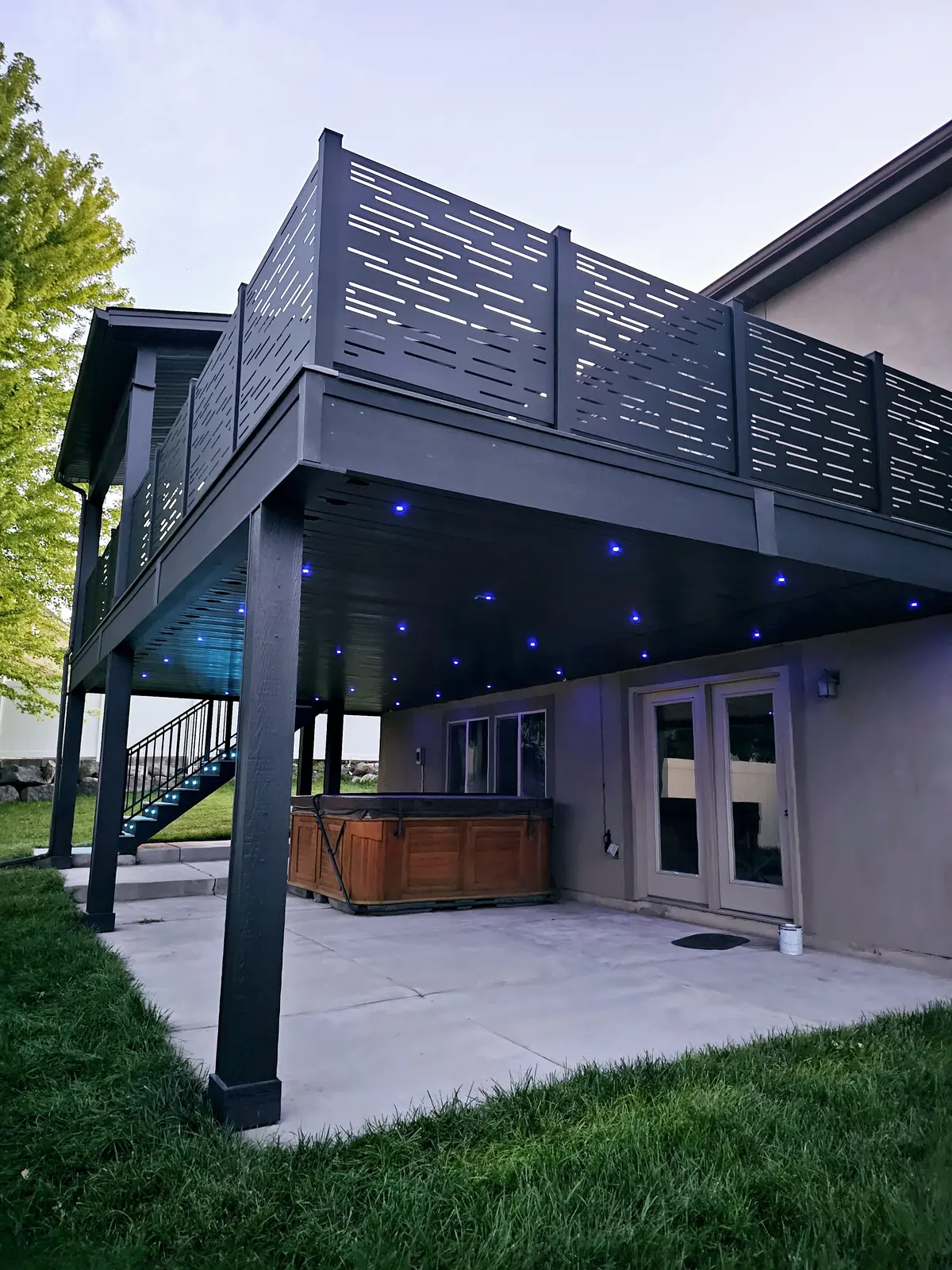 Blue fiber optic lights in the ceiling under a second-story deck