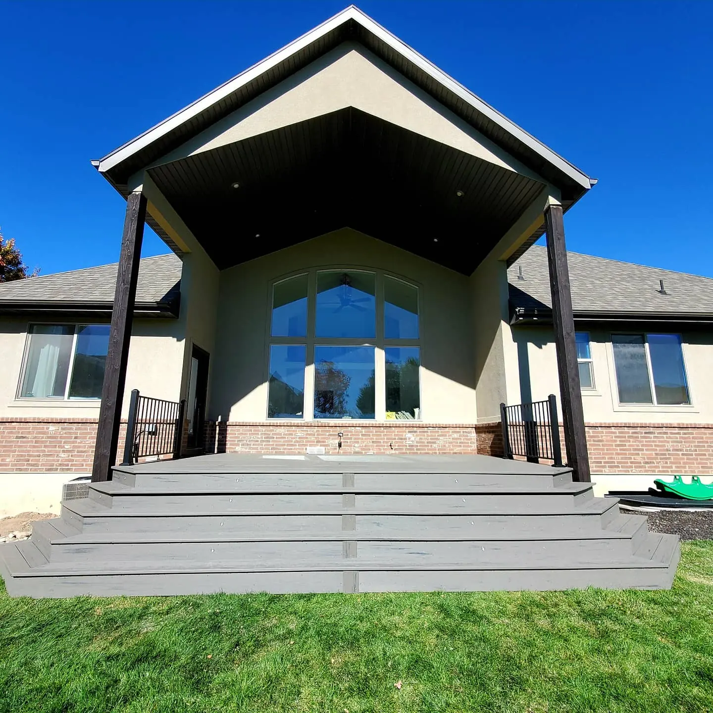 Gable roof over a deck with wide stairs