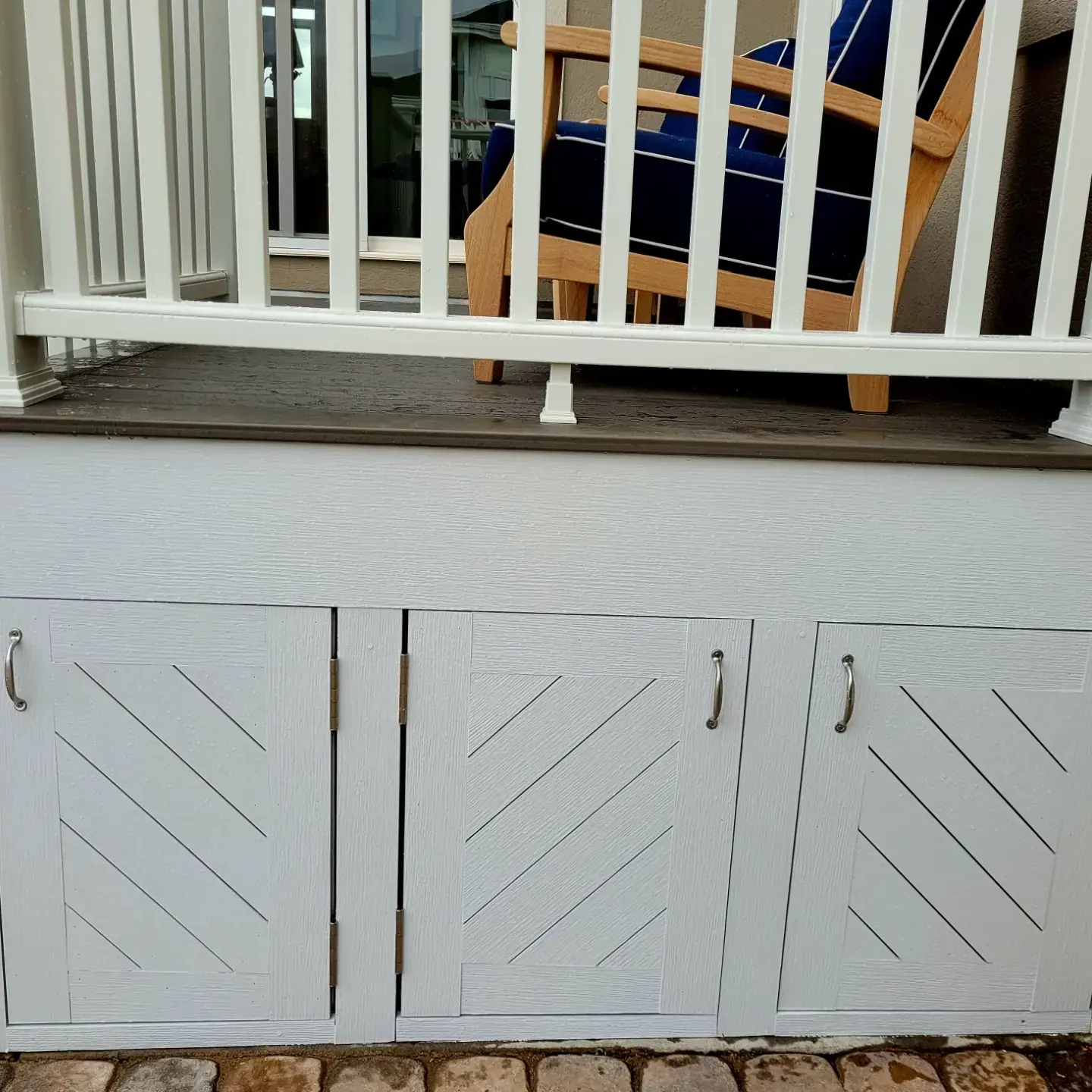 Under-deck storage with white doors