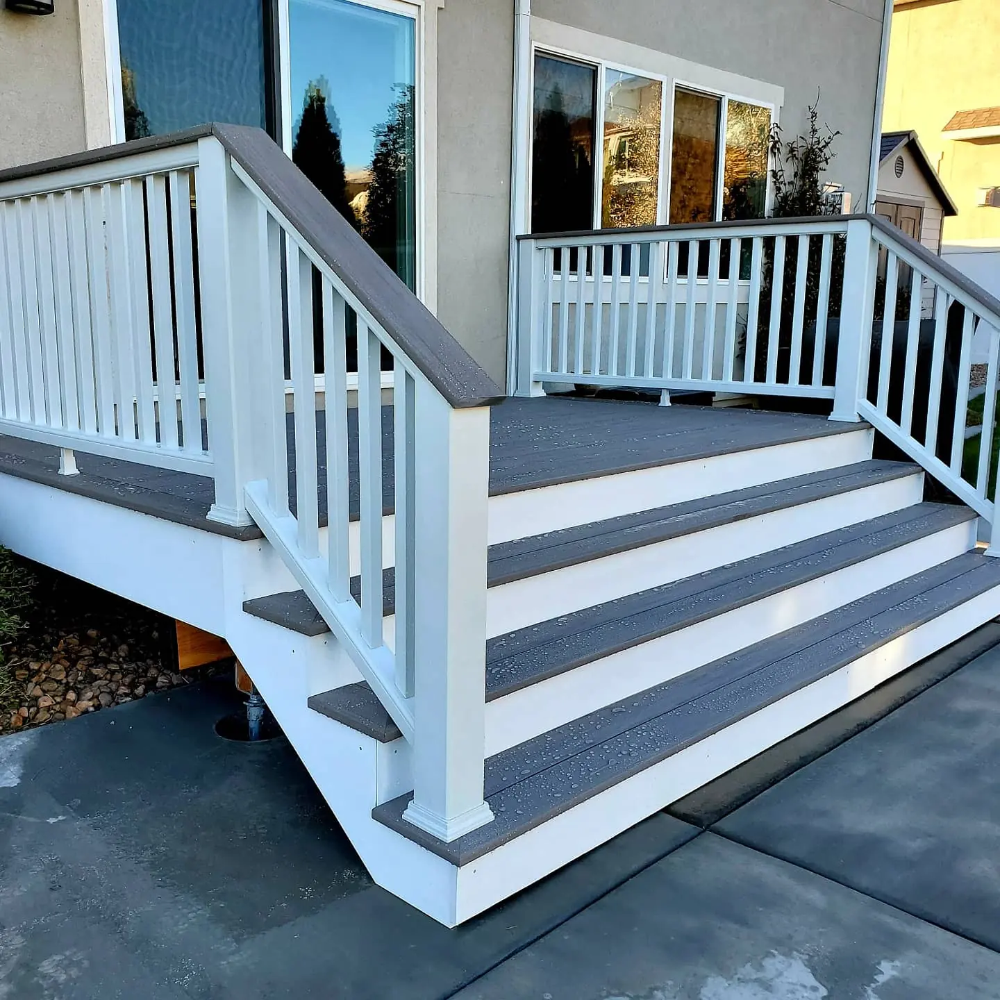 Wide composite stairs with white railing