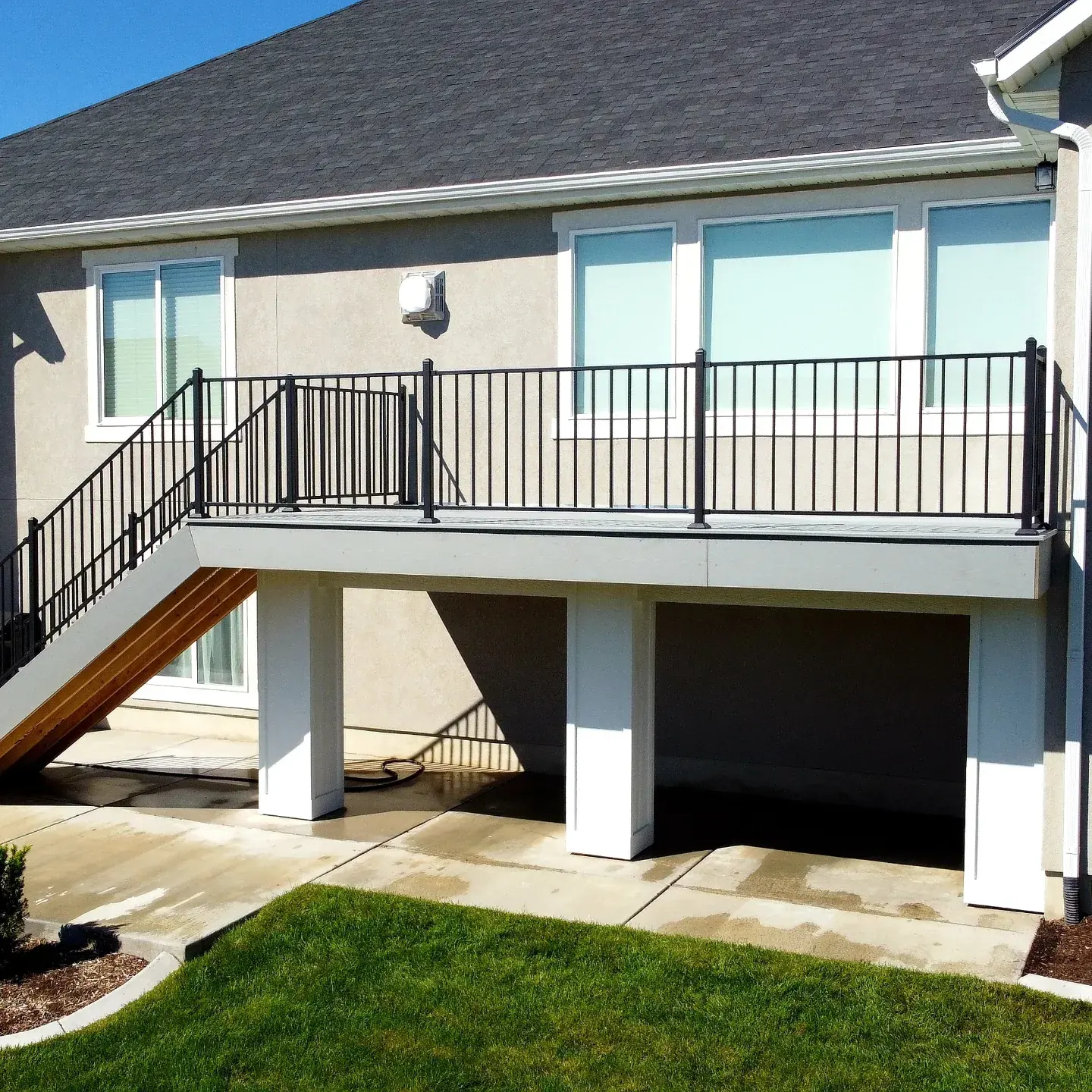 Second-story deck with white wrapped columns