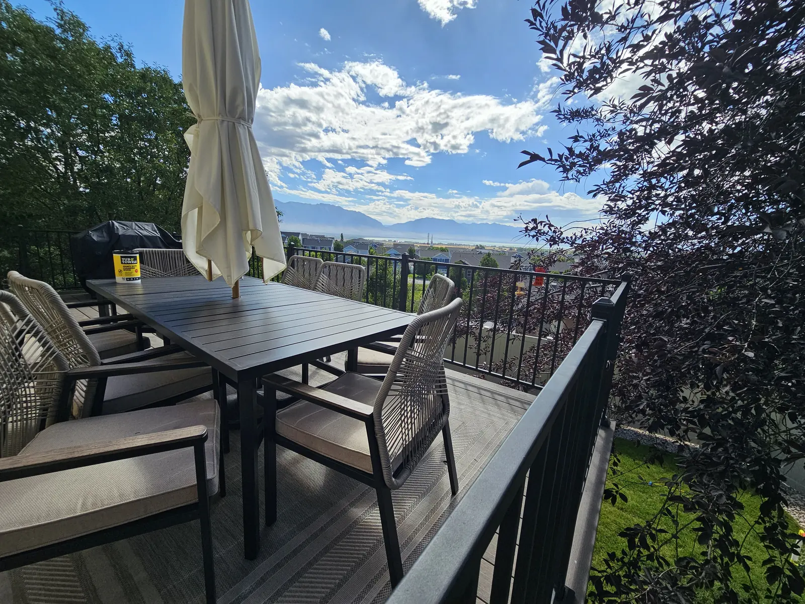 Composite deck dining area along black railing