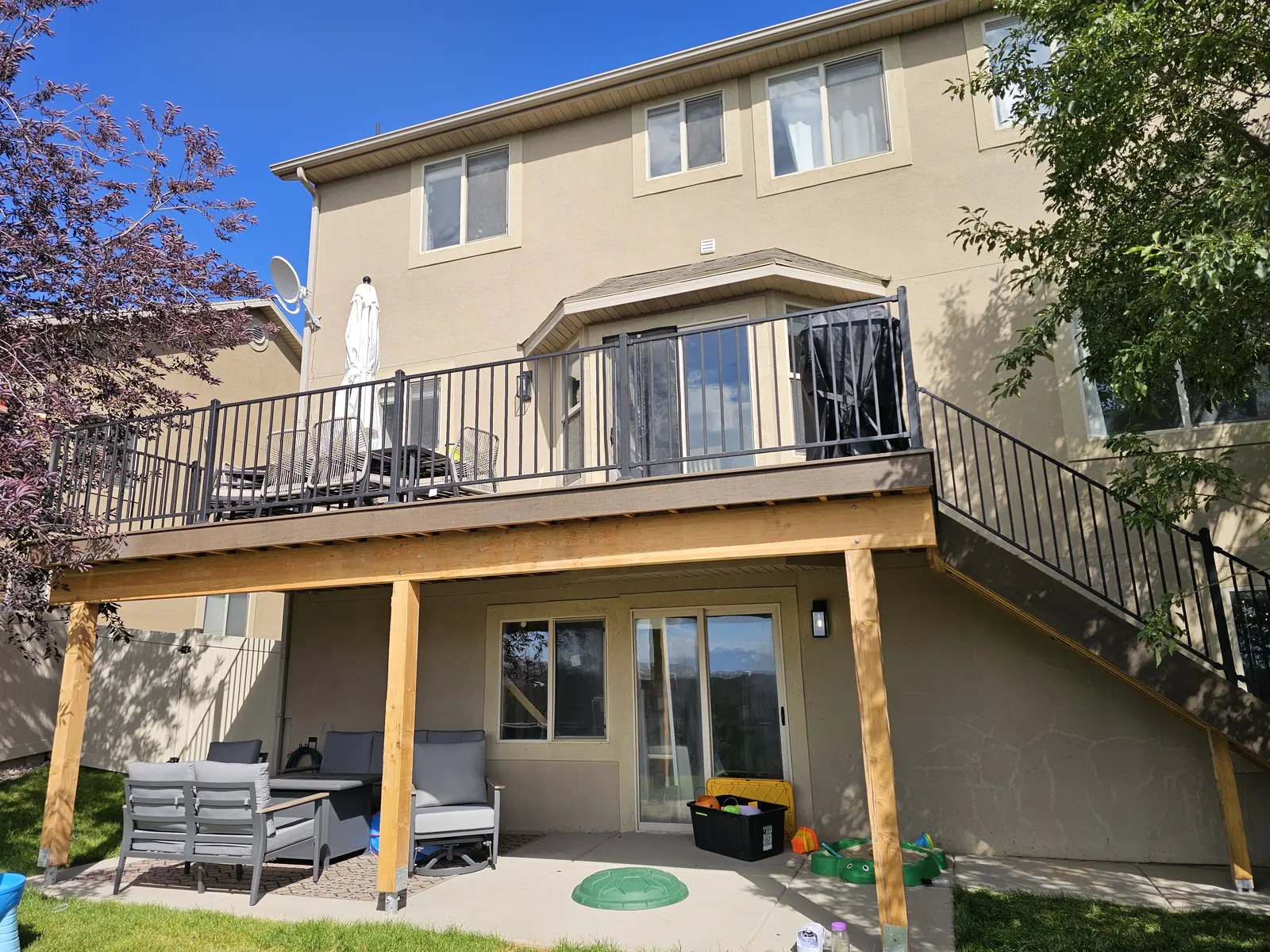 Second-story composite deck with black railing in Eagle Mountain, Utah