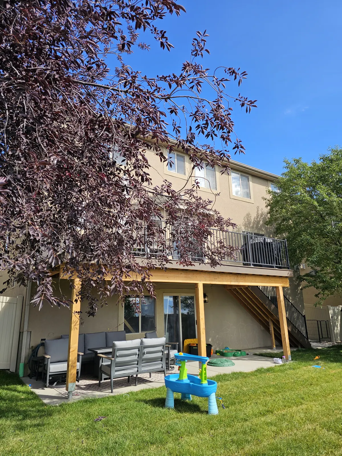 Second-story deck with a shaded patio below