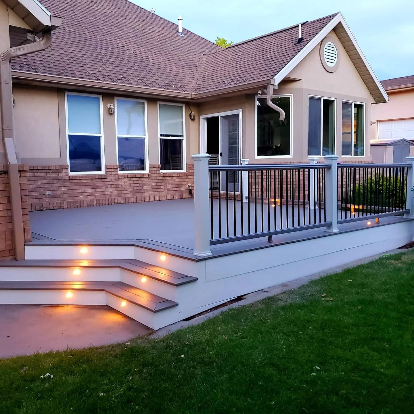 Trex Pebble Grey deck with lit stairs built by TC Decks in Lindon