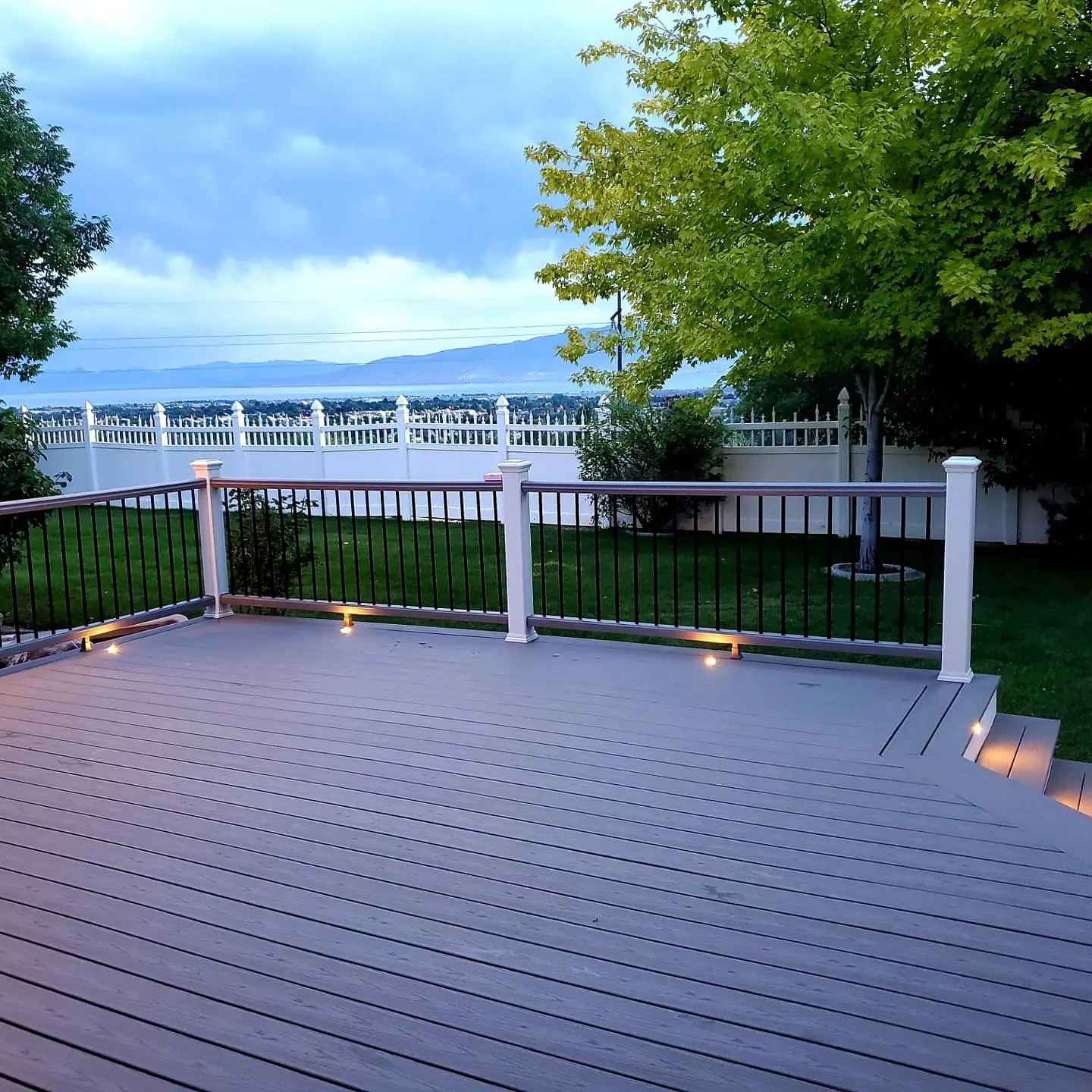 Trex Pebble Grey deck at dusk looking out over Utah Valley