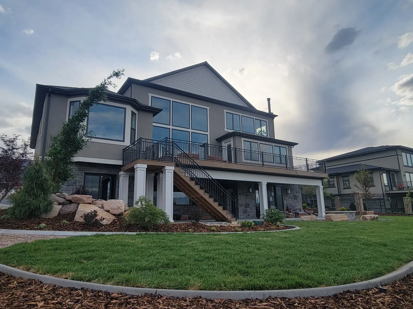 Close-up of TimberTech Tiger Wood deck boards and black railing