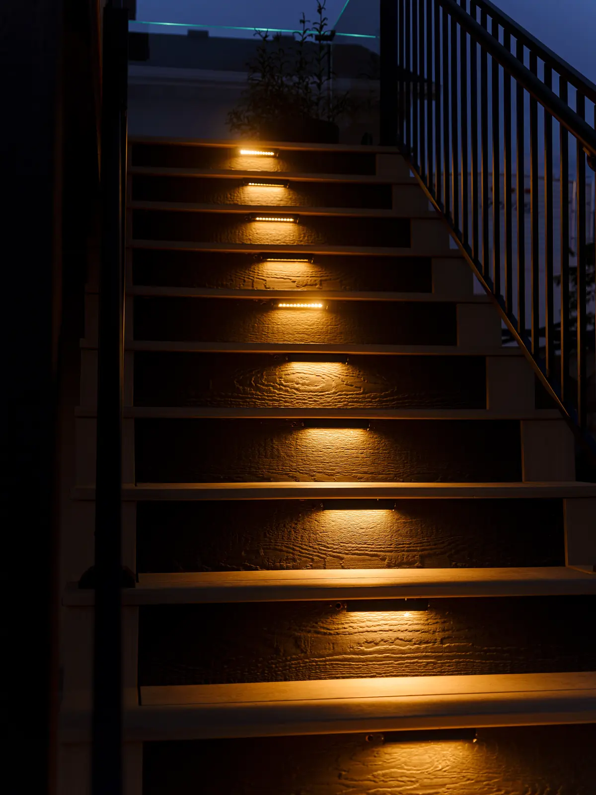Deck stair riser lights at night