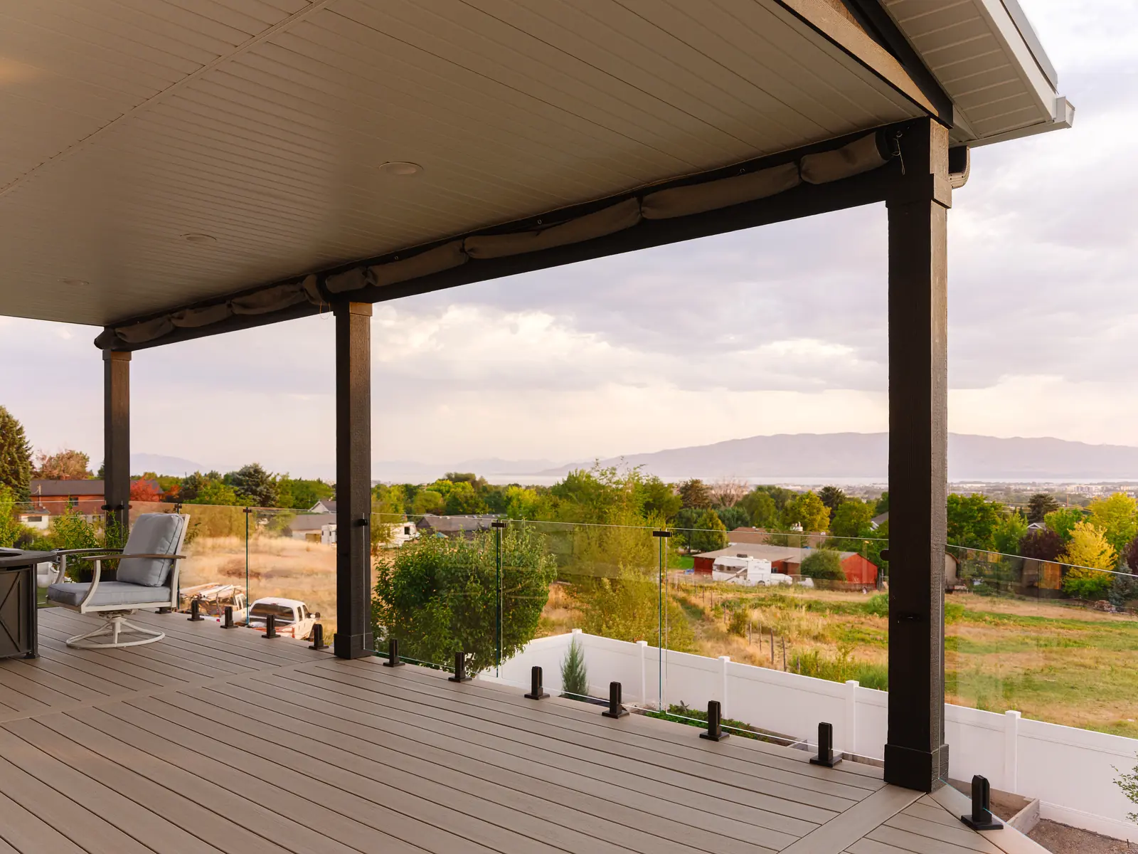 French White Oak deck with glass railing looking out over Utah Valley