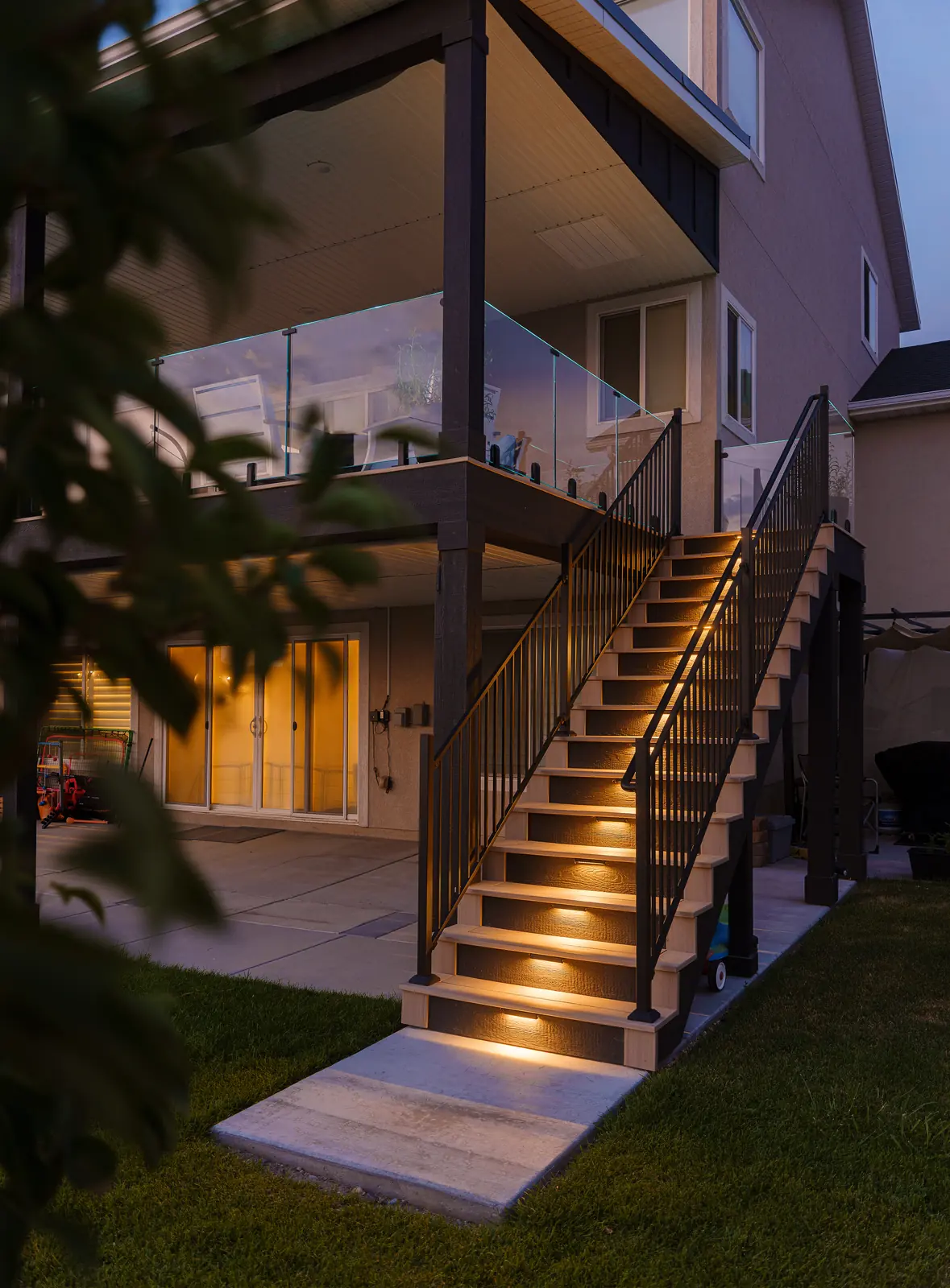 Deck stairs with riser lights at dusk