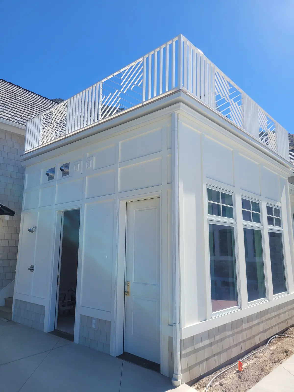 Rooftop deck with geometric white railing built by TC Decks in Provo