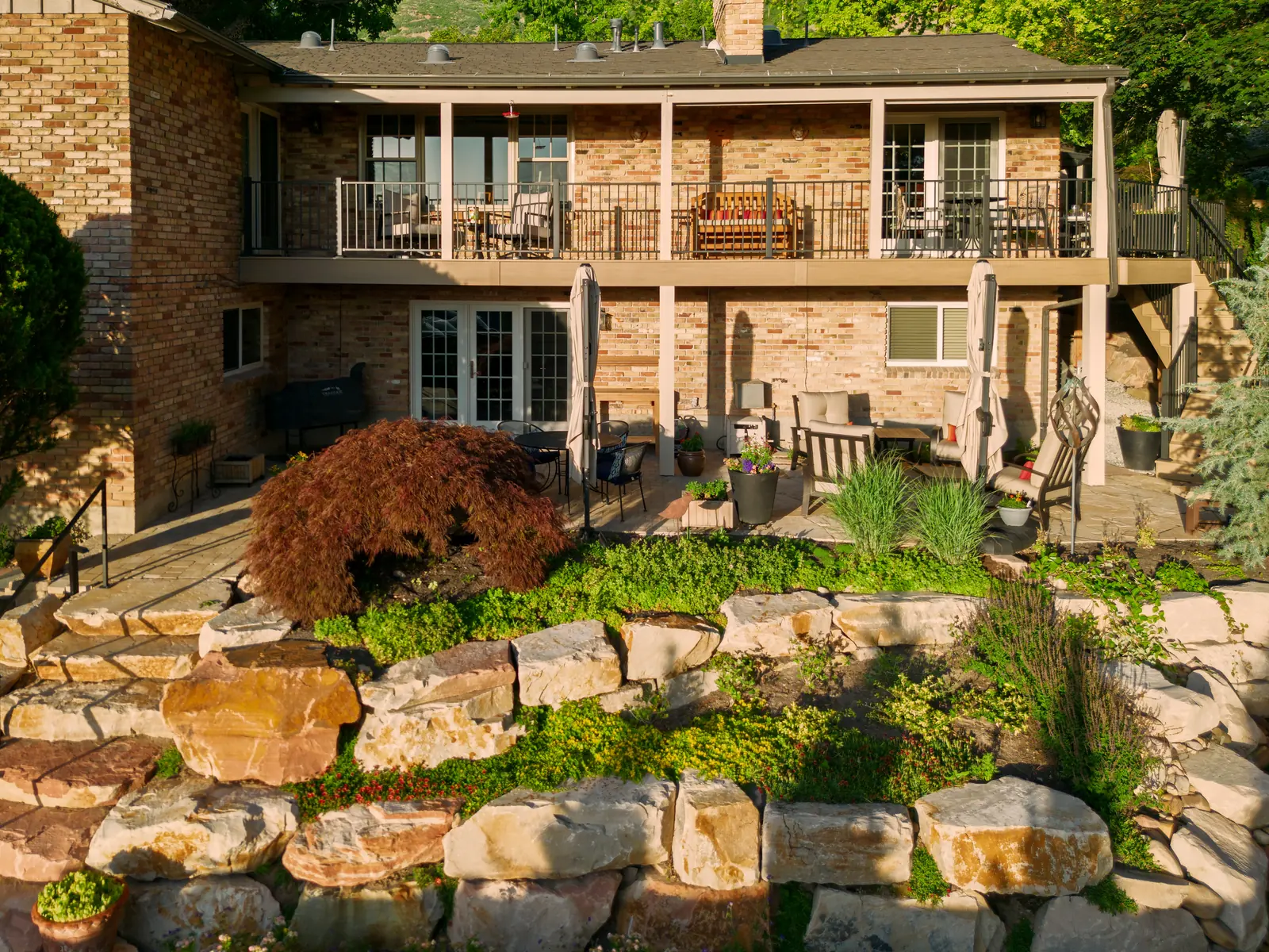 Weathered Teak deck above a terraced backyard in Sandy