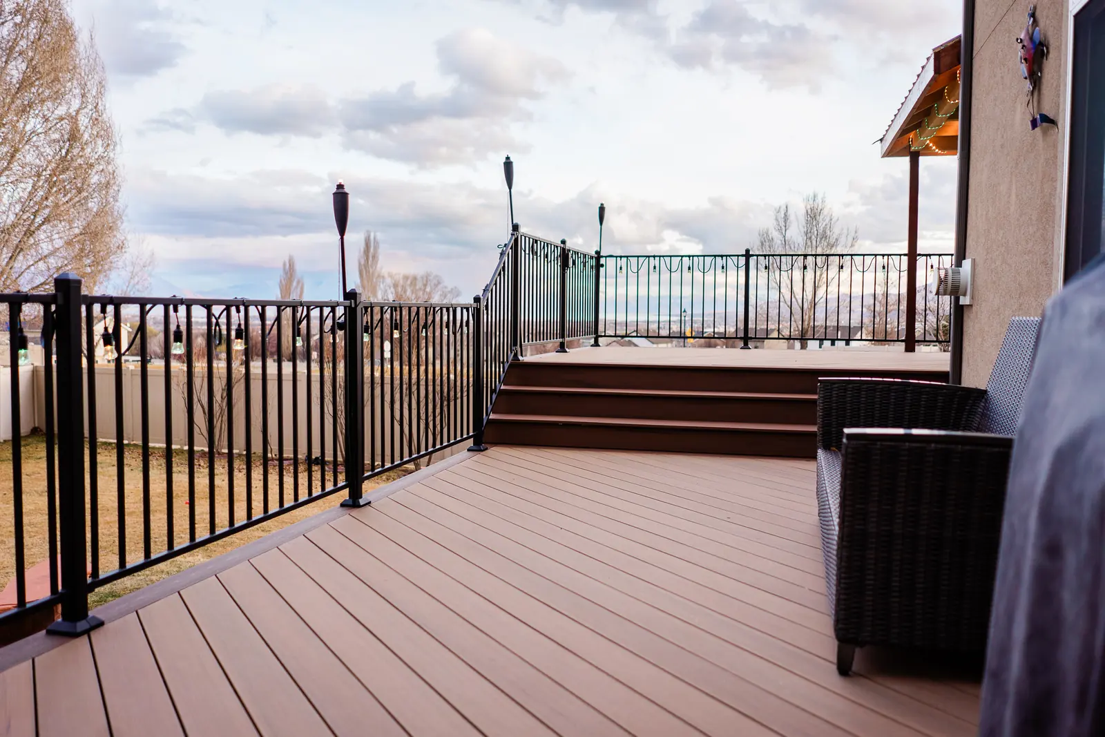 Coconut Husk decking with a Dark Cocoa picture-frame border and black Fortress railing