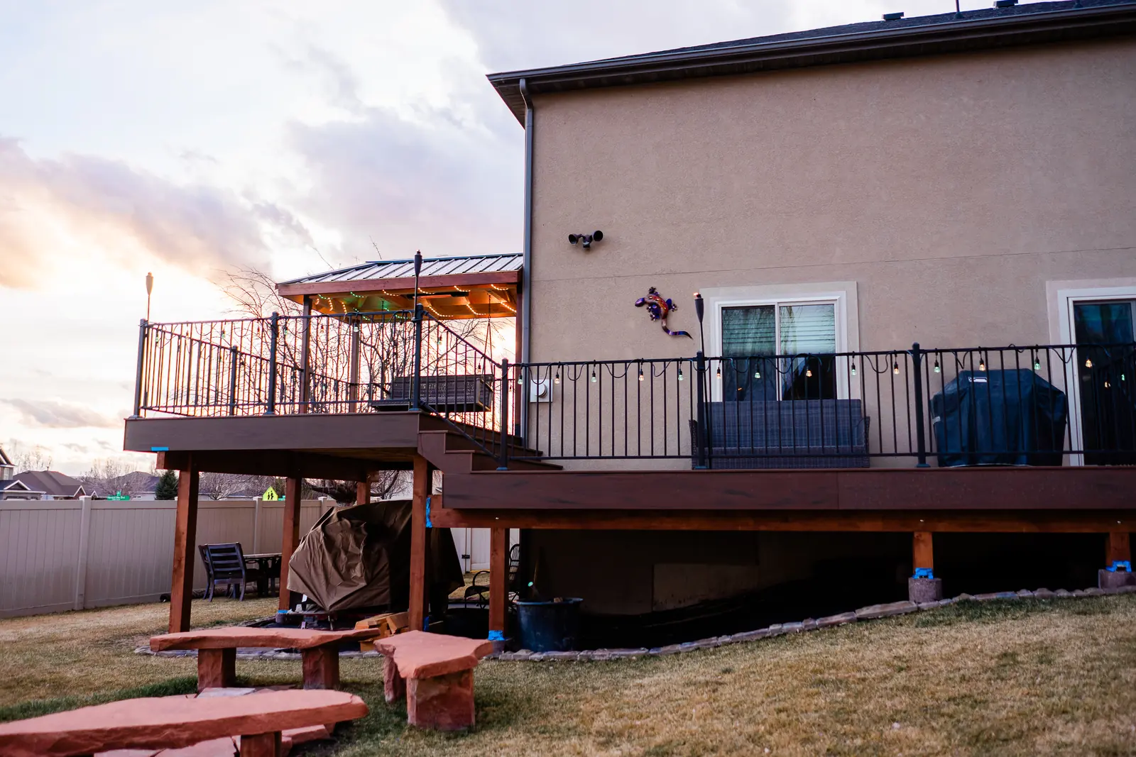 Raised two-level TimberTech deck across the back of a Saratoga Springs home