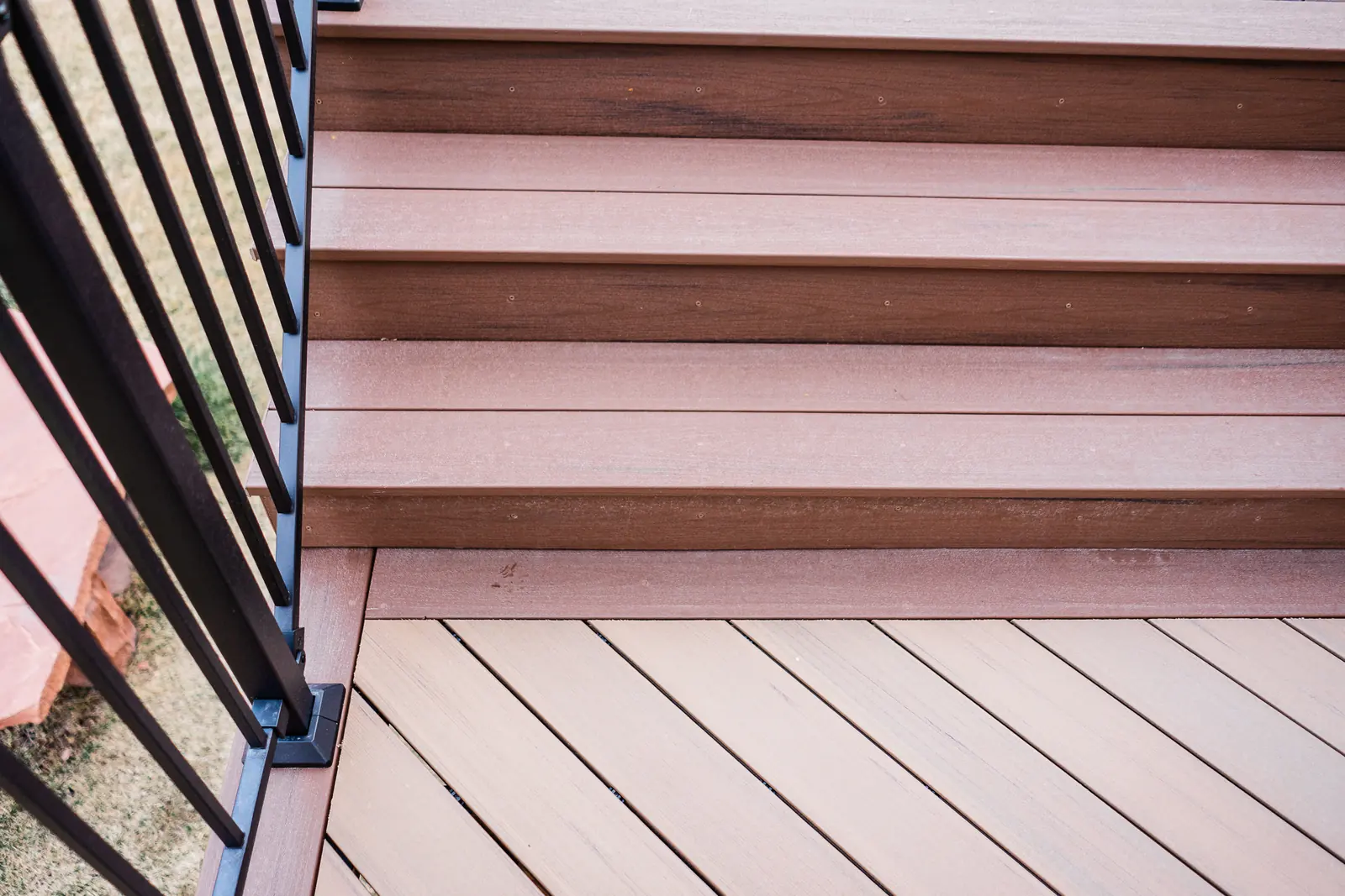Close-up of two-tone TimberTech steps in Dark Cocoa and Coconut Husk