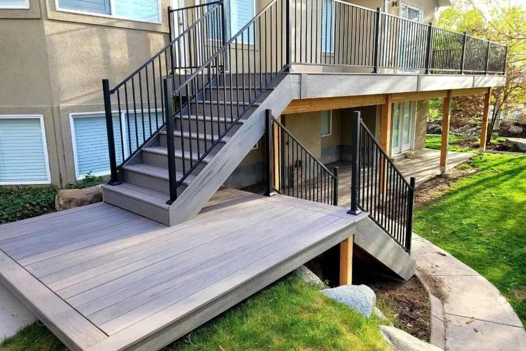 Luxurious wooden decks by TC Decks feature elegant white staircases.