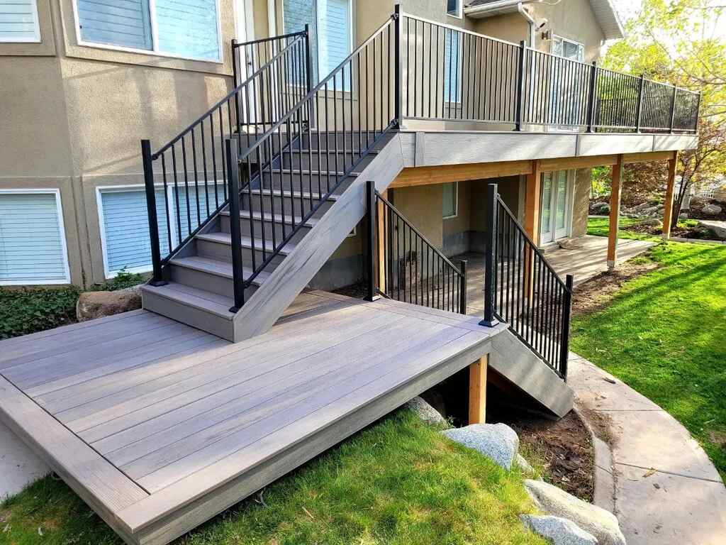 Luxury meets style on large wooden decks by TC Decks, featuring elegant staircases.