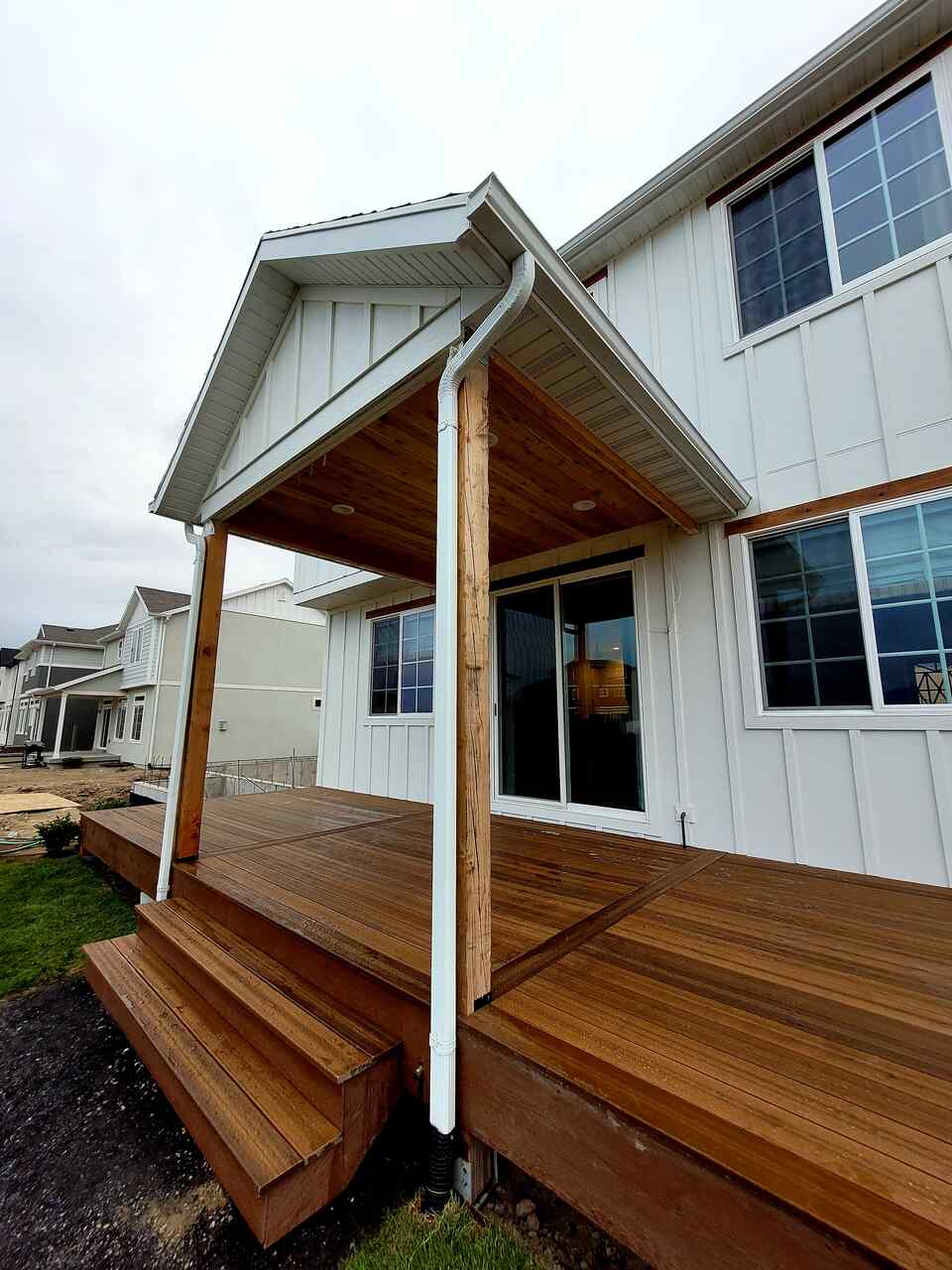 Enhance your home with a porch and window integration by TC Decks.