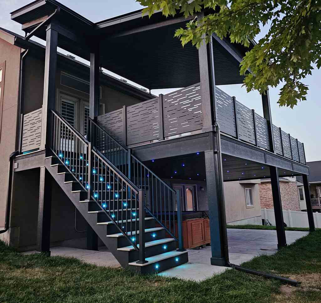 Stairways to large buildings by TC Decks feature elegant blue railings.