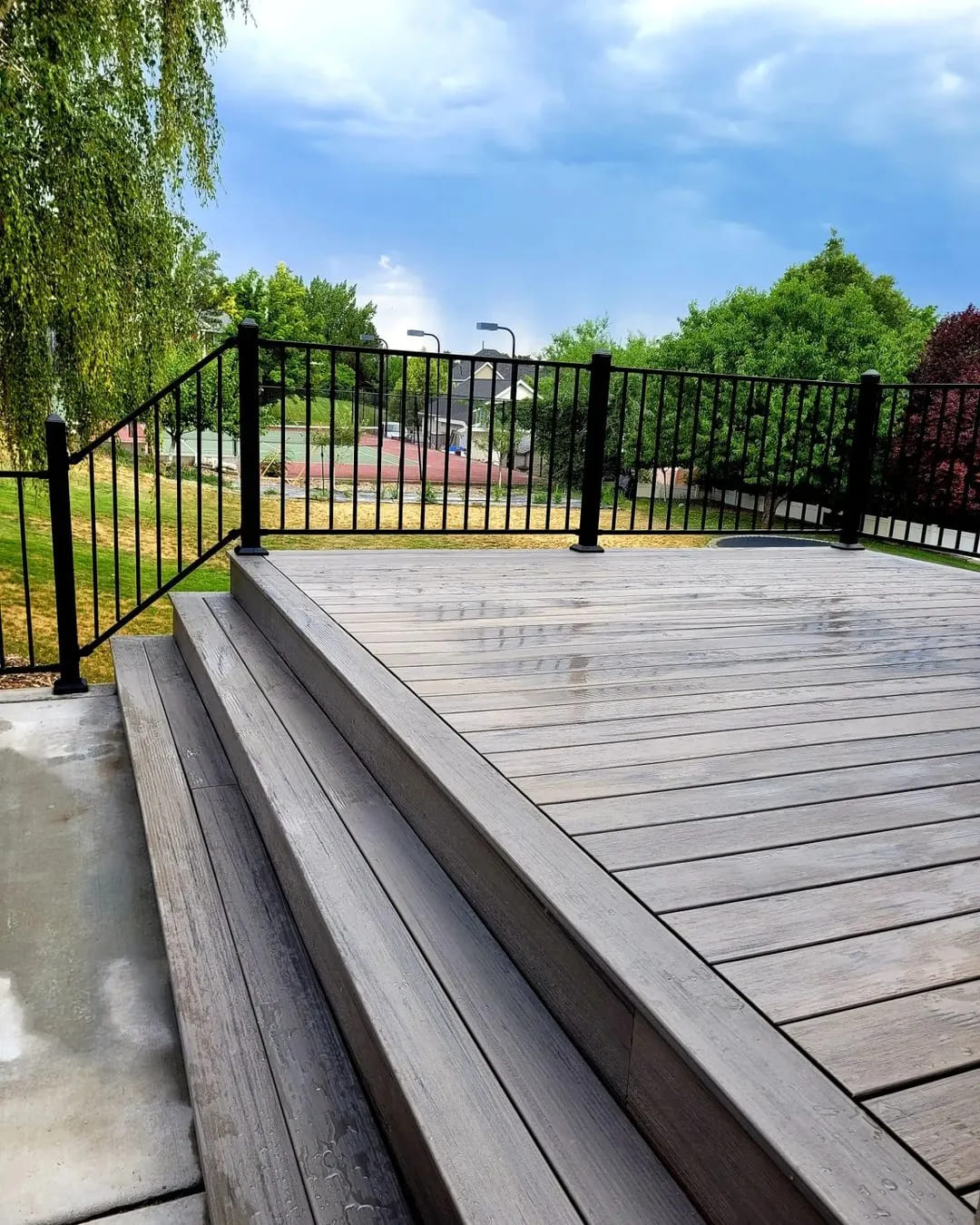 Enjoy poolside luxury on a wooden deck crafted by TC Decks.