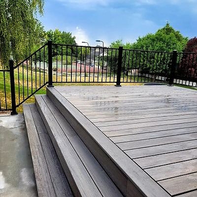 Enjoy poolside luxury on a wooden deck crafted by TC Decks.