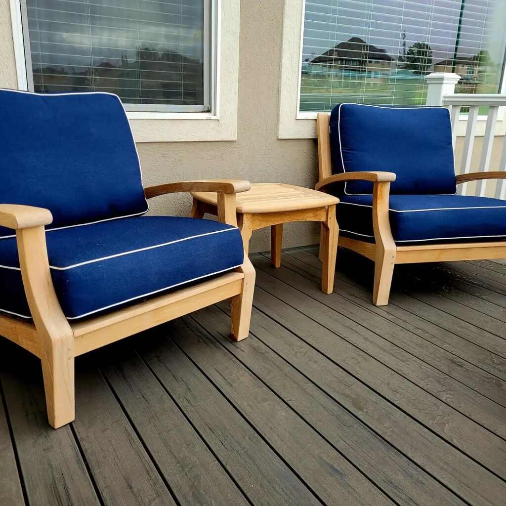 TC Decks makes living rooms cozy with blue couches and wooden tables.