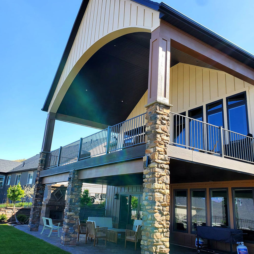 Large buildings with patios and balconies showcase TC Decks' craftsmanship.