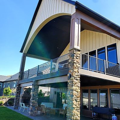 Large buildings with patios and balconies showcase TC Decks' craftsmanship.